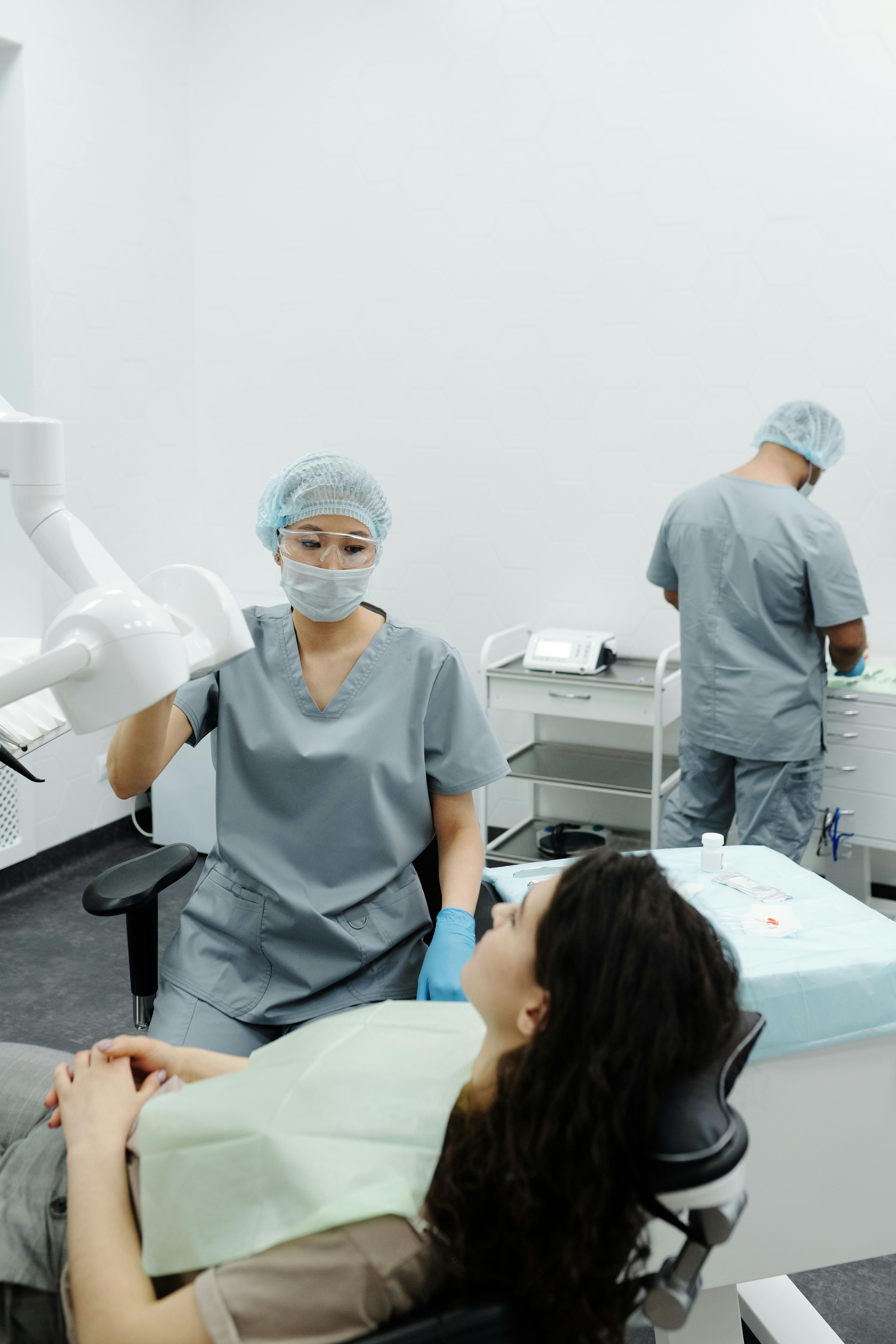 Dentist consulting with patient